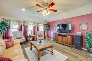 a living room with a couch and a tv at San Antonio Home - Outdoor Oasis and Greenbelt Views in San Antonio