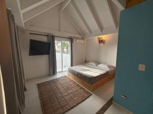 Voodi või voodid majutusasutuse Coco House by Be Happy toas