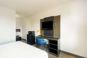 TV a/nebo společenská místnost v ubytování Motel 6-Del Rio, TX
