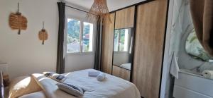 a bedroom with a bed and a large mirror at Villa Shaka Zulu in Figanières +16 photos
