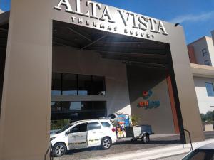 a white truck parked in front of a building at Alta Vista Thermas Resort in Caldas Novas