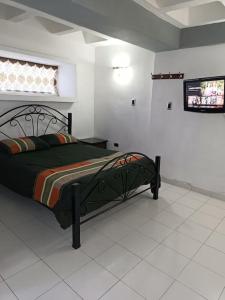 Ένα ή περισσότερα κρεβάτια σε δωμάτιο στο Apartamento de 1 habitacion con estacionamiento