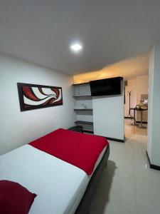 Voodi või voodid majutusasutuse Hotel Plaza Norte Cali toas