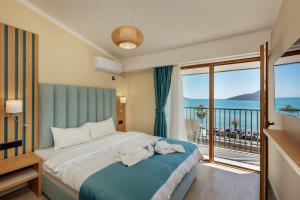 Postel nebo postele na pokoji v ubytování HOTEL TALIA
