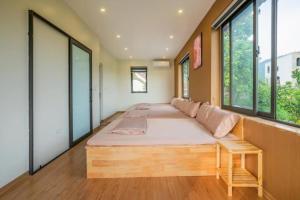 Postel nebo postele na pokoji v ubytování Moc Huong Villa Venuestay + 33 fotografií