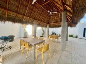 a patio with a table and chairs under a pavilion at Elegant Coastal Studio in Bucerías