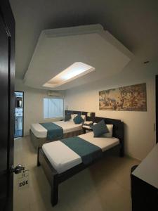 Voodi või voodid majutusasutuse Hotel Plaza Norte Cali toas