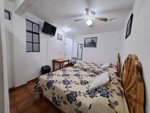 Postel nebo postele na pokoji v ubytování Hotel Las Palomitas