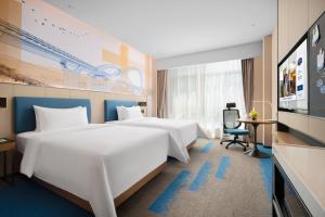 TV a/nebo společenská místnost v ubytování 南宁兴宁希尔顿欢朋酒店 Hampton by Hilton Nanning Xingning