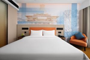 Postel nebo postele na pokoji v ubytování 南宁兴宁希尔顿欢朋酒店 Hampton by Hilton Nanning Xingning