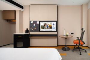 TV a/nebo společenská místnost v ubytování 南宁兴宁希尔顿欢朋酒店 Hampton by Hilton Nanning Xingning