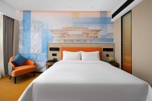 Postel nebo postele na pokoji v ubytování 南宁兴宁希尔顿欢朋酒店 Hampton by Hilton Nanning Xingning