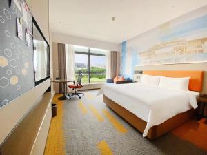 Postel nebo postele na pokoji v ubytování 南宁兴宁希尔顿欢朋酒店 Hampton by Hilton Nanning Xingning