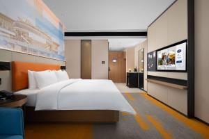 Postel nebo postele na pokoji v ubytování 南宁兴宁希尔顿欢朋酒店 Hampton by Hilton Nanning Xingning
