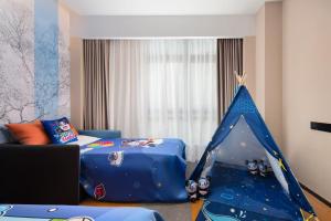 Postel nebo postele na pokoji v ubytování 南宁兴宁希尔顿欢朋酒店 Hampton by Hilton Nanning Xingning