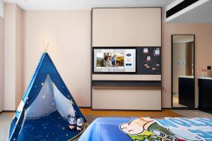 Postel nebo postele na pokoji v ubytování 南宁兴宁希尔顿欢朋酒店 Hampton by Hilton Nanning Xingning