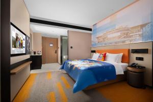 Postel nebo postele na pokoji v ubytování 南宁兴宁希尔顿欢朋酒店 Hampton by Hilton Nanning Xingning