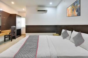 Ένα ή περισσότερα κρεβάτια σε δωμάτιο στο Collection O Elite Residency