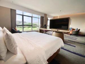 TV a/nebo společenská místnost v ubytování 南宁兴宁希尔顿欢朋酒店 Hampton by Hilton Nanning Xingning