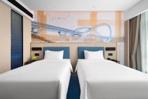 Postel nebo postele na pokoji v ubytování 南宁兴宁希尔顿欢朋酒店 Hampton by Hilton Nanning Xingning