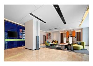 TV a/nebo společenská místnost v ubytování 南宁兴宁希尔顿欢朋酒店 Hampton by Hilton Nanning Xingning