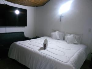 Postel nebo postele na pokoji v ubytování hotel laguna 24