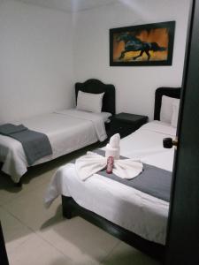 Postel nebo postele na pokoji v ubytování hotel laguna 24