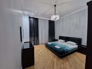 Ένα ή περισσότερα κρεβάτια σε δωμάτιο στο Green City Residence +29 φωτογραφίες