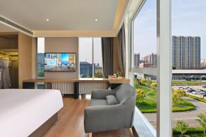 TV o dispositivi per l'intrattenimento presso Jingli Hotel Beijing Heshenghui Dajiaoting Subway Station Branch