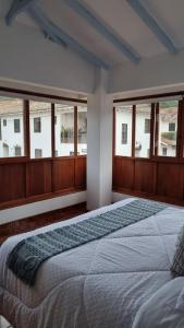 Postel nebo postele na pokoji v ubytování Cozy Home