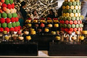 a display of different types of cakes and cupcakes at Sheraton Grand Sydney Hyde Park in Sydney +145 photos