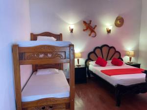 Postel nebo postele na pokoji v ubytování La Casa del Viajero Mompos