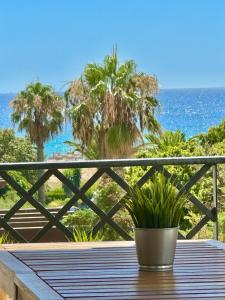 a patio table with a view of the ocean at Apartasuites Royal Zahara, Máximo confort con vistas al mar in Zahara de los Atunes