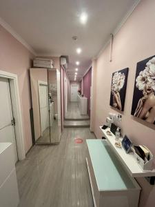 a bathroom with a sink and a mirror at F.Rooms Napoli in Naples