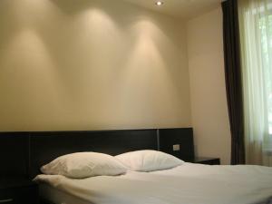 Säng eller sängar i ett rum på Splendor Resort and Restaurant