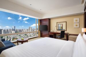 Cama ou camas em um quarto em Shangri-La Chengdu