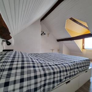 En eller flere senge i et værelse på Au perchoir duplex dans le centre historique