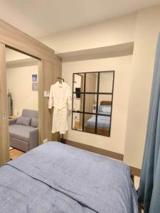 Ένα ή περισσότερα κρεβάτια σε δωμάτιο στο Casa Fama - Fame Residences Staycation