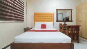 Postel nebo postele na pokoji v ubytování RedDoorz at GaDi Hotel San Jose del Monte City