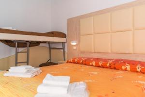 Llit o llits en una habitació de Hotel Croce Del Sud