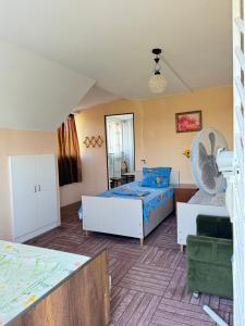 a living room with a bed and a couch at Beach House Anaklia in Anaklia