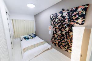 Postel nebo postele na pokoji v ubytování 結 Osaka