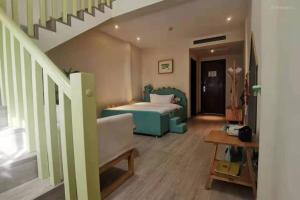 a bedroom with a bed and a stair case at Mount Emei Heyuan Serene Residence Hot Spring Hotel in Emeishan City