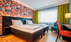 Postel nebo postele na pokoji v ubytování Thon Hotel Hammerfest
