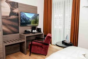 TV a/nebo společenská místnost v ubytování Central Hotel & Lounge Adult Only