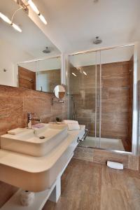 a bathroom with a large sink and a shower at Suite Deal in Rome