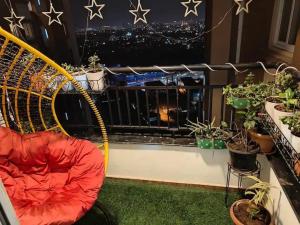 a hammock in front of a balcony with stars on the wall at Elite 3BHK- 19th Floor Only for Family in Bengaluru