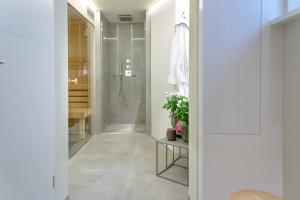 a bathroom with a walk in shower and a walk in closet at Family Hüs in Westerland (Sylt) +40 photos