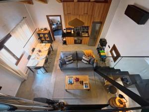 an overhead view of a living room with a couch at Las Horneras de Cobeta. Apartamento Florencia in Cobeta