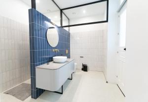 a bathroom with a sink and a mirror at 1924 Gemini House Jacuzzi, Garden, Rooftop in Nicosia +16 photos